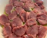 A picture of step 3 of Pork Medallions in a Mushroom and Sherry creamy sauce.