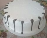 A picture of step 10 of Icing the cake n trying out on chocolate drips#authormarathon.