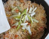 A picture of step 6 of Tom yum shrimp rice.