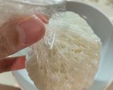 A picture of step 3 of Onigiri with bonito flakes and cheese.