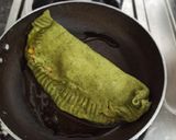 A picture of step 15 of Spinach Corn Ravioli in white sauce.