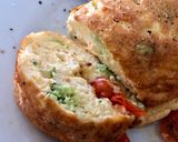 A picture of step 6 of Cheddar, Broccoli and Red Chilli Soufflé Omelette, Garlic roasted Cherry Plum Tomatoes, Olive Oil.