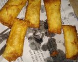 A picture of step 12 of Tikka spring rolls.