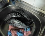 A picture of step 1 of Turmeric fried fish.