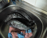 A picture of step 1 of Turmeric fried fish.