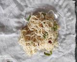A picture of step 9 of Cheesy Noodles with Dumplings.