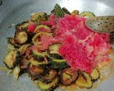 A picture of step 5 of Punjabi bitter gourd rounds in tomato gravy.