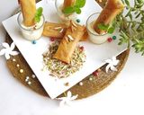 A picture of step 11 of Moong Dal Halwa Cigars dipped in Shaahi Rabdi.