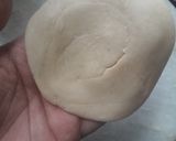 A picture of step 4 of Satpura (Deep fried dessert).