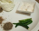 A picture of step 2 of Malai boti pizza with white sauce.
