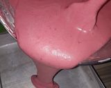 A picture of step 6 of Strawberry milk cake with whipped cream frosting.
