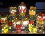 A picture of step 13 of Kunafa and Qashtalia Decorated with Oranges, Strawberries, and Bananas.