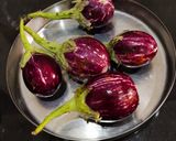 A picture of step 1 of Stuffed Brinjal Curry.