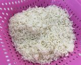 A picture of step 3 of Corn and beans palm oil rice.