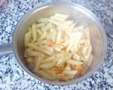 Foto del paso 7 de la receta Plumas a la boloñesa con 5 quesos al horno
