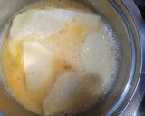 A picture of step 6 of Fried yam coated with egg and spicy fry sauce.
