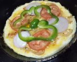 A picture of step 5 of Pizzta (pasta pizza).