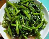 A picture of step 4 of Unbeatable Garlic Stir-Fried Water Spinach.