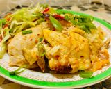 A picture of step 5 of Chicken thighs with rice in the oven.
