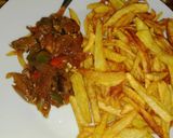 A picture of step 5 of Kibda (Egyptian liver sauce) and French fries.