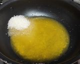 A picture of step 3 of Orange Bread balls.