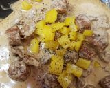A picture of step 4 of My Tenderloin pork& Sausage in a creamy Mustard Pepper sauce. 😉.