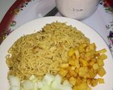 A picture of step 1 of Indomie with fried Irish potato and cucumber #teamabuja.