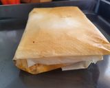 Foto del paso 4 de la receta: Salmón al papillote con costra de queso ricotta y salsa harissa acompañado por rovellons salteados