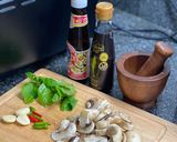 A picture of step 3 of Grilled salmon with stir-fried mushroom with Thai basil.