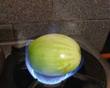 A picture of step 1 of Baigan bharta.
