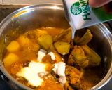 A picture of step 4 of Chicken in spicy coconut gravy with potatoes #WYH (VERY SPICY).