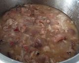 Foto del paso 7 de la receta Manitas de cerdo con tomate, jamón y morro