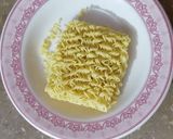 A picture of step 2 of Tomato soup with noodles and chicken ♥️.