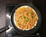 A picture of step 3 of Schezwan paneer masala dosa.