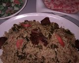 A picture of step 3 of Jallof rice and cos low with water melon.