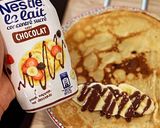 Une image de l'étape 7 de Pâte à crêpes à la Banane (et crêpes fourrés à la banane, topping chocolat, flambée au Rhum blanc).