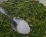 A picture of step 5 of Chinese stir fry - Snow Peas with dried shrimps and garlic.
