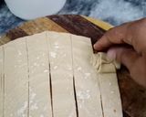 A picture of step 4 of Roll paratha in desi ghee.
