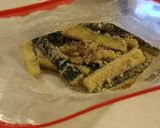 A picture of step 4 of Parmesan zucchini fries with spicy appetizer dipping sauce.