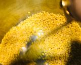 A picture of step 1 of Narkel diye Bhaja Muger Dal: Bengali Style- Yellow Moong Dal with Coconut (Without Onion-Garlic).