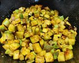 A picture of step 4 of Roti with brinjal aloo fry.