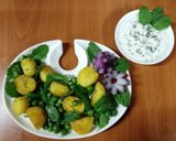 A picture of step 4 of Peas potatoes, mint salad with creamy yoghurt dip.