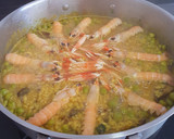 Foto del paso 5 de la receta: Arroz integral de cigalitas con fondo de restos pescado asado