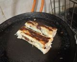 A picture of step 2 of Nuetella and banana french toast roll ups.