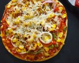A picture of step 10 of Corn Pizza.