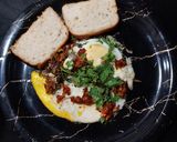 A picture of step 3 of Khagina with Garlic bread.