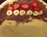 A picture of step 6 of Basic Crepe with strawberry banana Nutella spread.