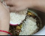 A picture of step 14 of Rangeen Pulao.