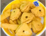 A picture of step 10 of #Karela,fish,layers,flower,  net and triangle shaped Nimkis.
