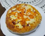 A picture of step 6 of Pizza covered with homemade Mozzarella Cheese & Sausage.